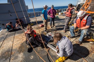 The crew helping the science team assemble a drifter on the back deck.  Photo credit: Robyn Von Swank, instagram @vonswank